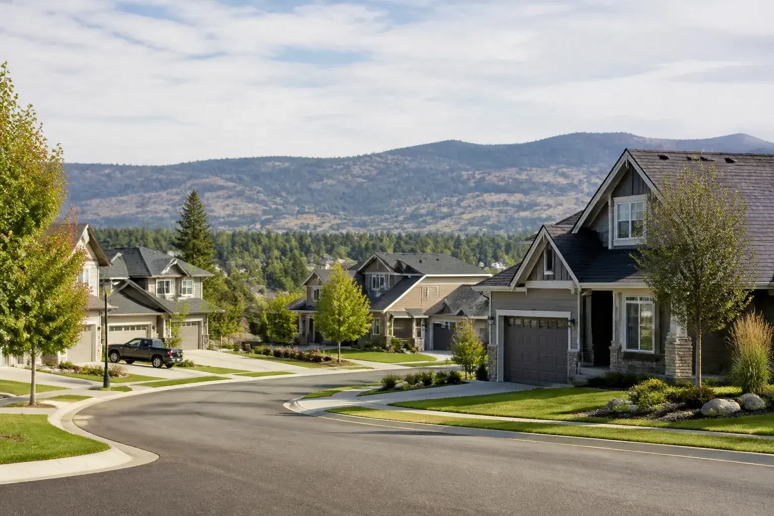 Suburban Spokane Valley street with foothills in the distance